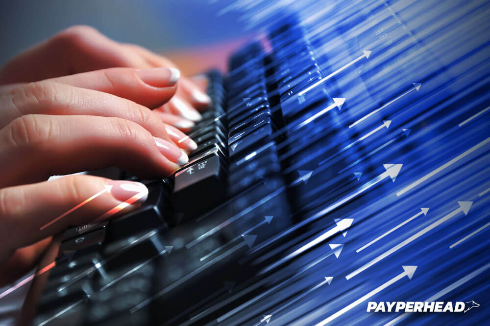 MovingToPayPerHead concept womans hands using computer keyboard